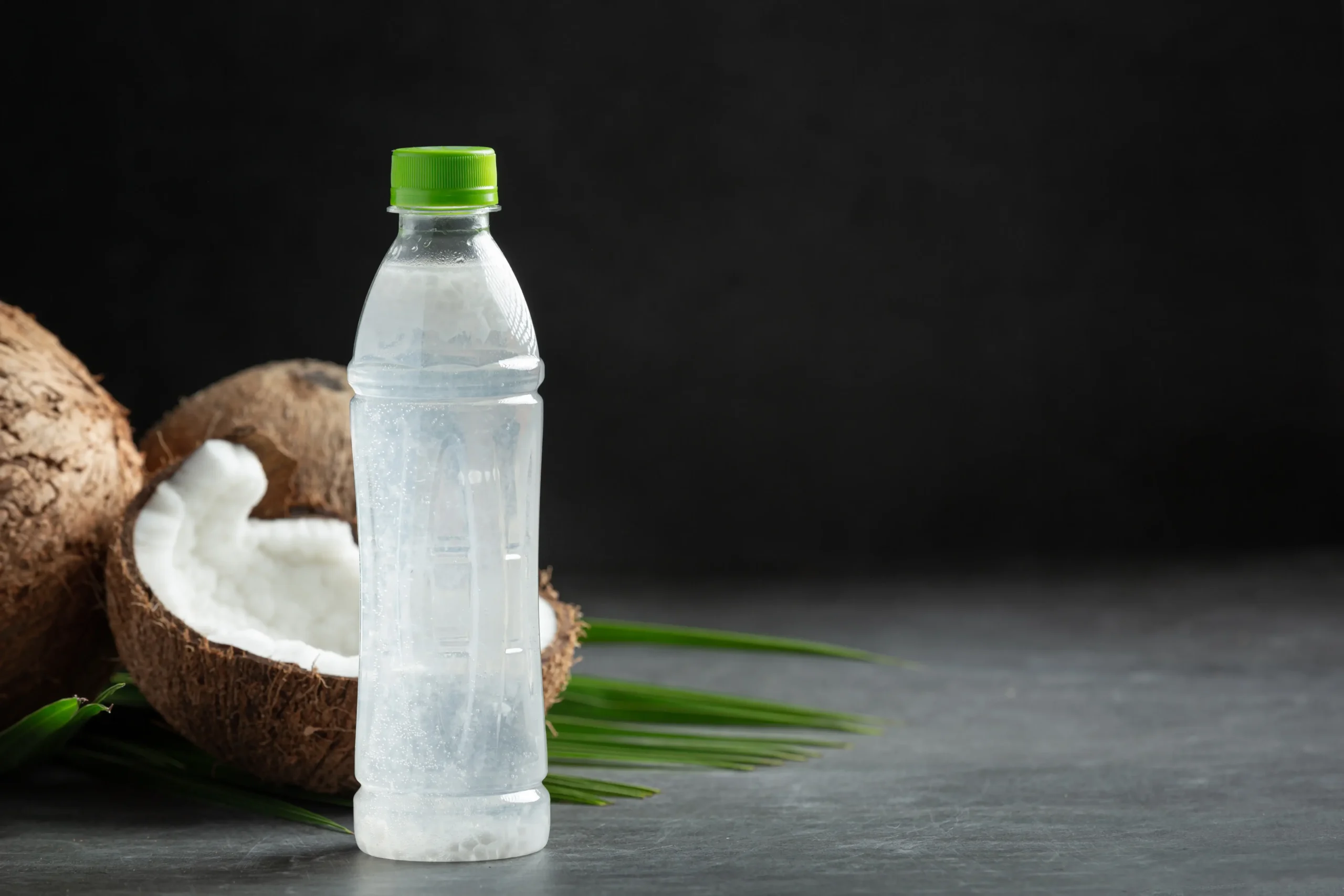 bottle coconut water put dark background 1 scaled